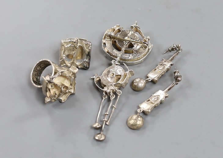 A suite of Norwegian 925s jewellery by Juhls Kautokeino, comprising a pendant brooch, 92mm, pair of drop earrings and a dress ring and one other dress ring by Juhls.